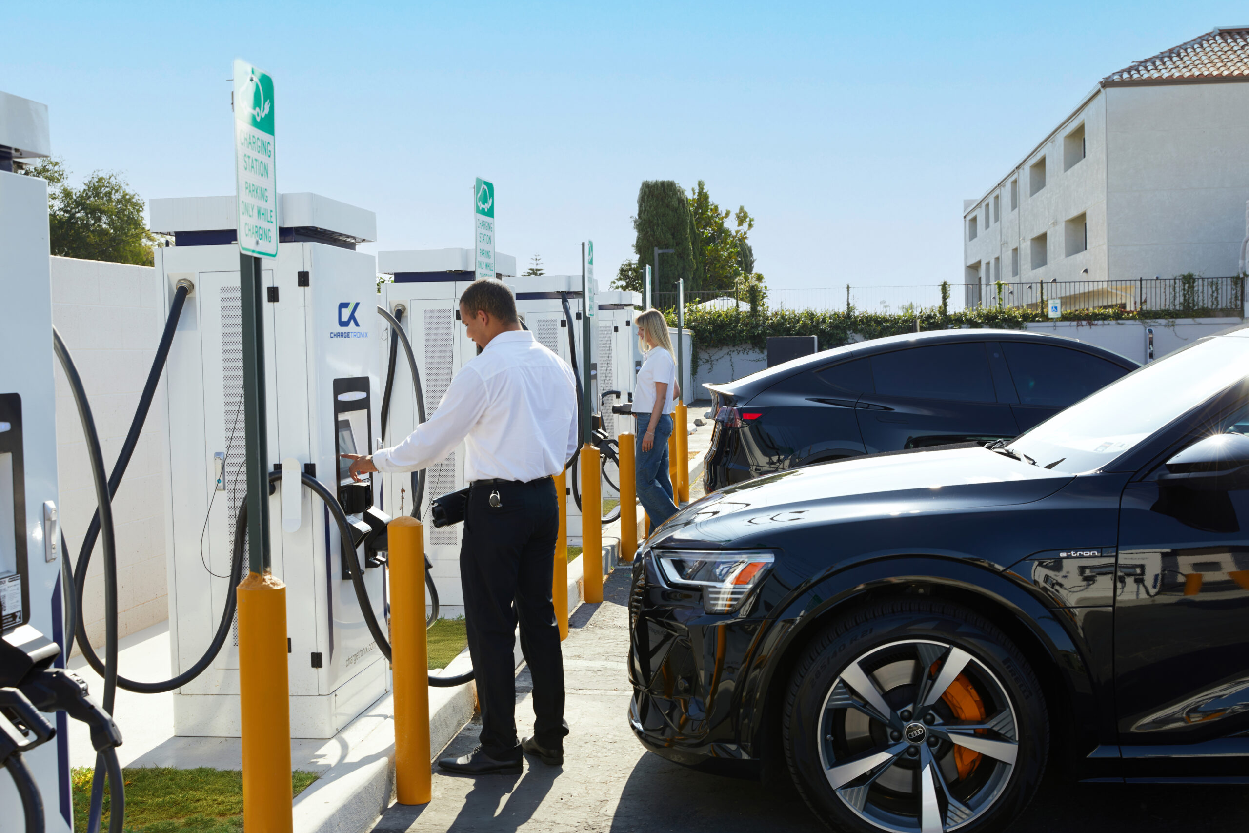 2 ev cars at a ChargeTronix charging station.